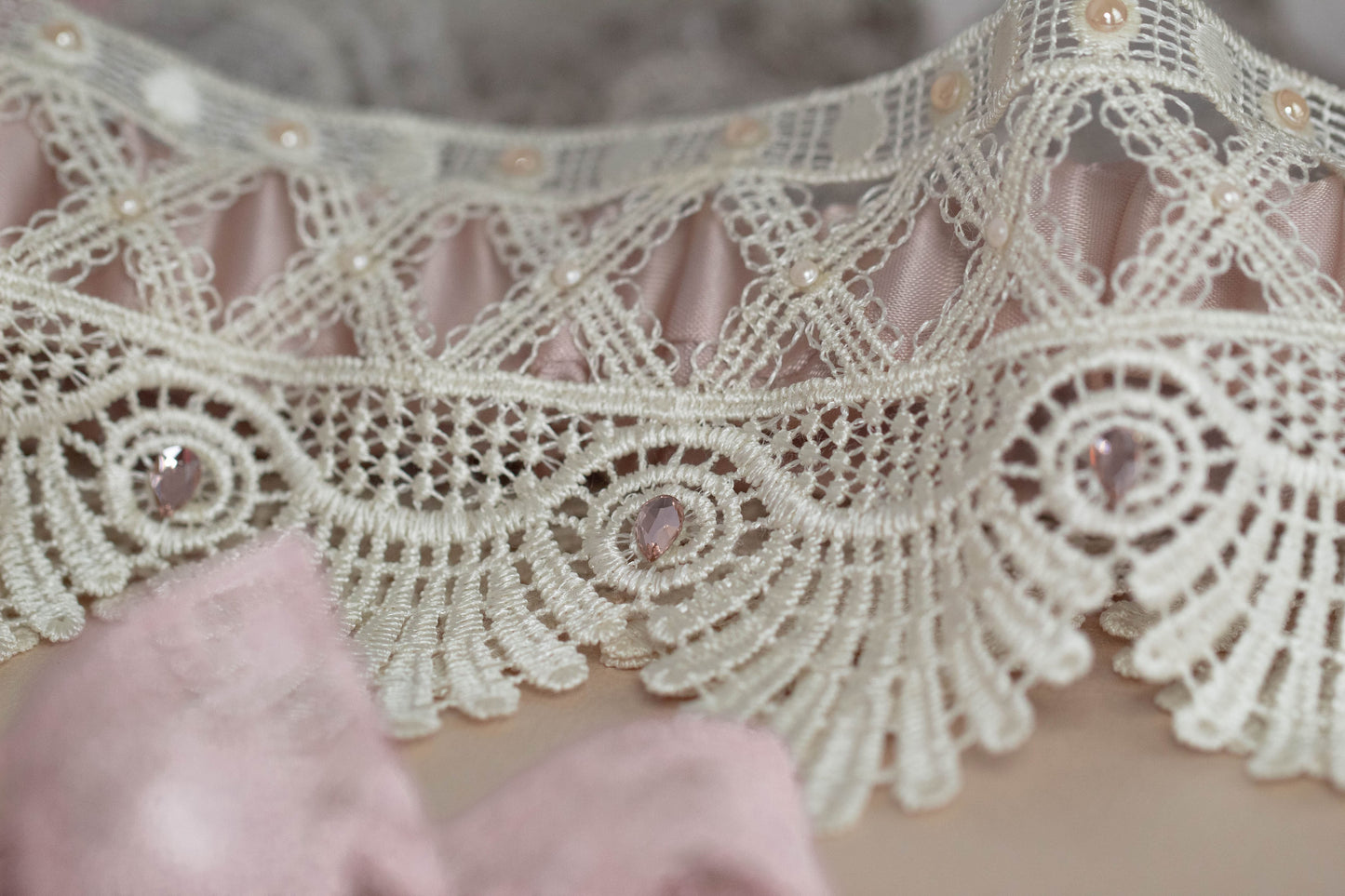 Beige and ivory garter with pink crystals